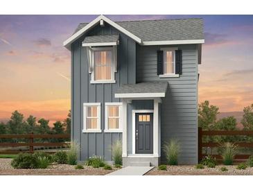 Charming two-story home features vertical siding, white trim, and a welcoming front entrance at 6601 E 148Th Dr, Thornton, CO 80602