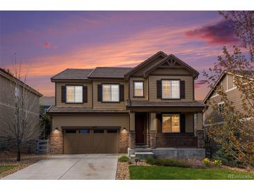 Charming two-story home with a well-maintained front lawn and attached two-car garage at 3522 Harvard Pl, Broomfield, CO 80023