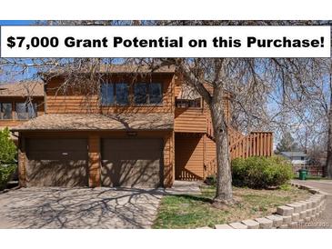 Charming two-story home with a two-car garage, mature trees, and a well-maintained front yard at 2279 E 129Th Ave, Thornton, CO 80241