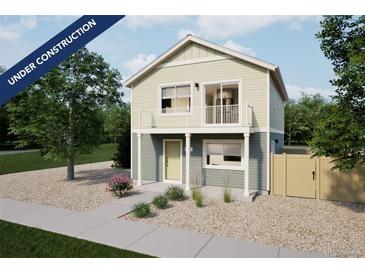 Charming two-story home with a balcony and neutral siding offers modern living with a welcoming facade at 46505 Avery Ln, Bennett, CO 80022