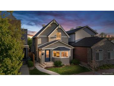 Charming home featuring a walkway, quaint bay window and a well-manicured lawn at 1832 W 36Th Ave, Denver, CO 80211