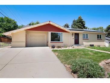 Charming single-story home featuring a well-maintained front yard, attached garage, and neutral exterior paint at 5067 S Mabre Ct, Littleton, CO 80123
