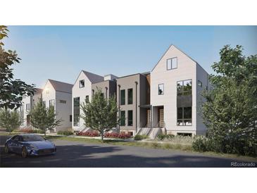 Stylish townhomes boasting unique architectural details and landscaping, creating an inviting street view at 532 Lombardi Cir, Louisville, CO 80027