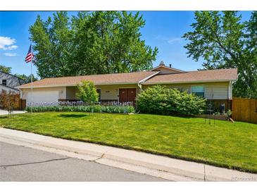Charming ranch-style home featuring a well-manicured lawn and lovely curb appeal at 3570 E Arapahoe Pl, Centennial, CO 80122