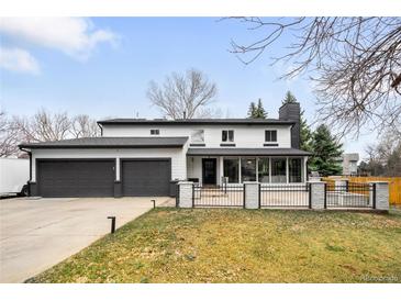 Beautiful two-story home with a three-car garage and landscaped front yard at 4362 Peach Ct, Boulder, CO 80301