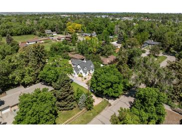 Expansive aerial view of the house surrounded by lush, mature trees in a quiet neighborhood at 1033 Estes St, Lakewood, CO 80215