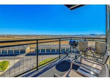 Relaxing balcony with scenic views and seating at 13598 Via Varra # 301, Broomfield, CO 80020