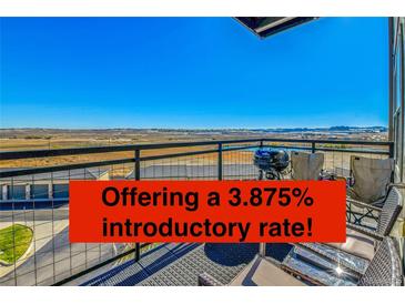 Enjoy beautiful views from this spacious balcony with plenty of room for outdoor dining and relaxation at 13598 Via Varra # 301, Broomfield, CO 80020