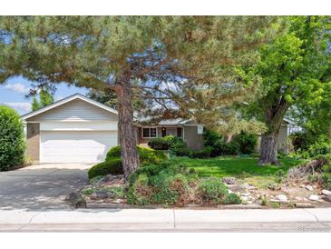 Charming home with lush landscaping and mature trees in a desirable neighborhood at 10150 Melody Dr, Northglenn, CO 80260