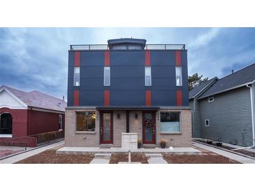 Modern two-unit building with dark-blue and red accents at 443 Galapago St, Denver, CO 80204