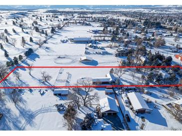 Expansive property showcasing a beautiful home and sprawling, snow-covered grounds bordered by a red boundary line at 8530 W Jefferson Ave, Denver, CO 80235