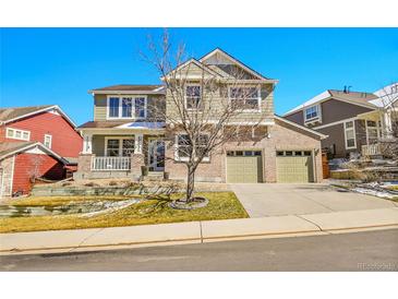 Charming two-story home with a brick facade and well-maintained landscaping with attached two car garage at 3644 Sunchase Dr, Castle Rock, CO 80109