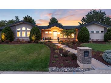 Beautiful ranch home with landscaped yard, walkway, and stone mailbox at 43 Fairway Ln, Littleton, CO 80123