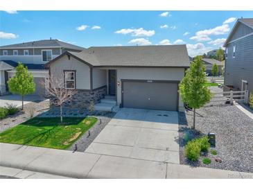 Charming single-Gathering home with a two-car garage and well-maintained landscaping at 1868 Makley Loop, Castle Rock, CO 80104
