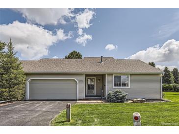 Charming single-story home with a well-maintained front yard and attached garage at 13940 E Linvale Pl, Aurora, CO 80014
