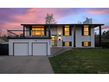 Charming two-story home with a two-car garage, balcony, and landscaped front yard at 794 W Elati Cir, Littleton, CO 80120