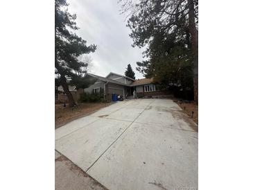 Charming home featuring an extra long driveway and a welcoming exterior at 7863 S Harrison Cir, Centennial, CO 80122