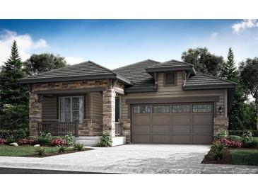 Charming single-Gathering home with stone accents and a two-car garage offers great curb appeal at 12749 W Glasgow Pl, Littleton, CO 80127