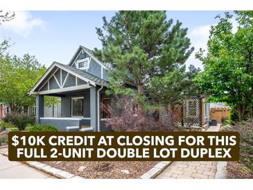 Charming gray duplex featuring a welcoming front porch, landscaped yard, and mature trees in a desirable neighborhood at 1518-1520 S Sherman St, Denver, CO 80210