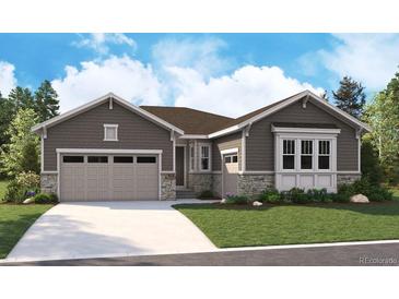 Charming single-story home featuring a two-car garage, stone accents, and meticulous landscaping at 5602 Riverbend Ave, Firestone, CO 80504
