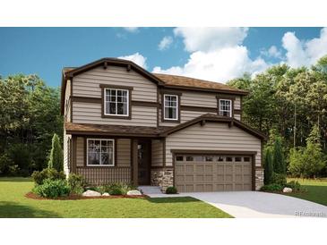 Charming two-story home with a landscaped front yard and a two-car attached garage at 1374 Lumber Ridge S Cir, Erie, CO 80516