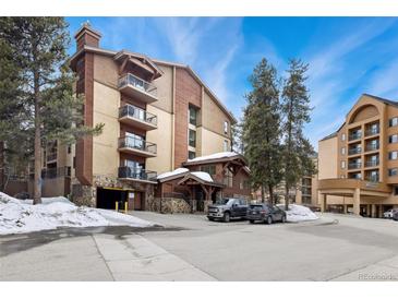 Inviting exterior showcases balconies and covered parking for mountain living at 720 Columbine Rd # B, Breckenridge, CO 80424