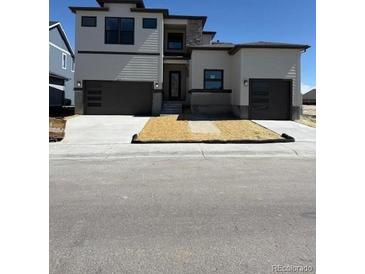 Two-story home with a two-car garage and a low-maintenance yard at 898 Coal Bank Trl, Castle Rock, CO 80104