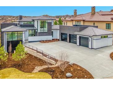 Stunning new construction home with a three-car garage and modern architecture at 8132 Galileo Way, Littleton, CO 80125