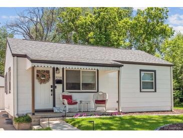 Charming exterior view of home featuring a cozy porch with decorative accents at 3218 S Lafayette St, Englewood, CO 80113