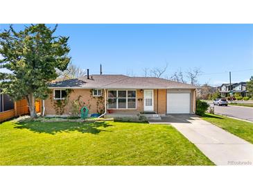 Charming single-story brick home with a well-maintained lawn and mature landscaping at 2698 Fern Dr, Westminster, CO 80030