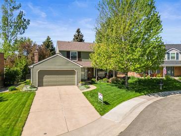 Charming home featuring a well-manicured lawn, mature tree, and inviting curb appeal at 5225 S Everett Ct, Littleton, CO 80123