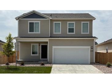 Charming two-story home with a two car garage, neutral siding, and well-maintained lawn at 2174 Alyssa St, Fort Lupton, CO 80621
