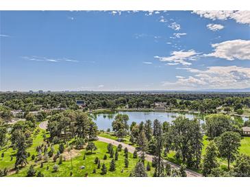 Stunning aerial view of a park with lake and lush greenery and city skyline beyond at 480 S Marion Pkwy # 1601, Denver, CO 80209