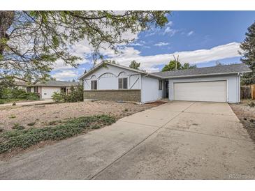 Charming single-Gathering home featuring a two-car garage and a well-maintained front yard at 12879 E Oregon Dr, Aurora, CO 80012