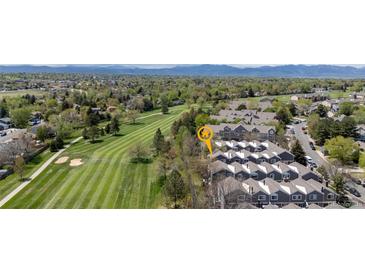 Stunning aerial view of condo community backing to golf course with mountain views at 6730 W 84Th Cir # 96, Arvada, CO 80003