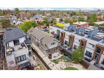 Stunning aerial view of the modern home with a well-manicured backyard and an inviting patio area at 1832 W 33Rd Ave, Denver, CO 80211