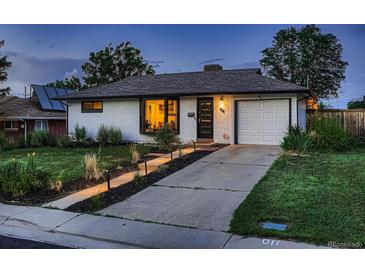 Charming single-story home with brick exterior, well-kept lawn, and inviting curb appeal at 40 Benton St, Lakewood, CO 80226