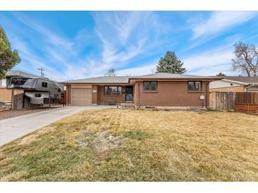 Charming brick home with a well-maintained front yard, offering a classic and inviting curb appeal at 9231 Irving St, Westminster, CO 80031