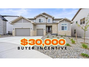 Beautiful two-story home with stone accents, a wide driveway, and a $30,000 buyer incentive at 5411 Edenborn Way, Castle Rock, CO 80104