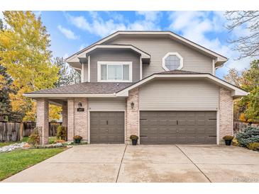 Charming two-story home featuring a three-car garage, brick accents and a beautifully landscaped front yard at 11687 Decatur Dr, Westminster, CO 80234