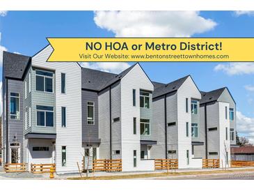 Modern townhome exteriors showcasing contemporary design, gray and white siding, and ample natural light from large windows at 5385 W 14Th Ave, Lakewood, CO 80214