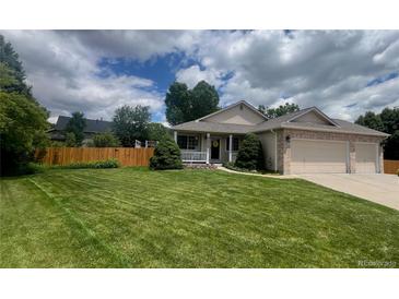 Charming single-Gathering home with manicured lawn and a spacious three-car garage at 13112 Summit Grove Pkwy, Thornton, CO 80241