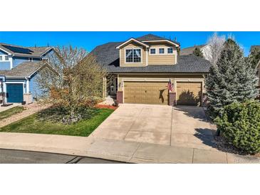 Inviting two-story home with a three-car garage and well-maintained landscaping at 7378 Geode Ct, Castle Rock, CO 80108