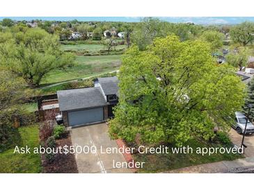 Charming home featuring an attached garage and mature trees and close proximity to open space and trails at 10759 Clermont St, Thornton, CO 80233