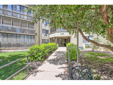 Inviting building entrance featuring manicured landscaping and a well-maintained walkway at 14390 E Marina Dr # 403, Aurora, CO 80014