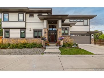 Charming home featuring a stone facade, well-manicured landscaping, and a welcoming entrance at 5420 Baseline Rd, Boulder, CO 80303