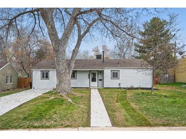 Charming single-story home with a well-maintained lawn and mature trees at 3342 S Flamingo Way, Denver, CO 80222