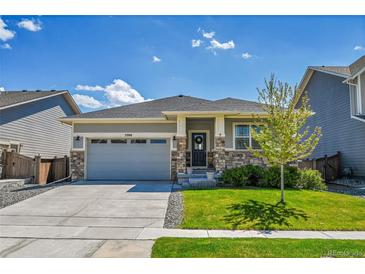 Charming single-Gathering home featuring a well-kept lawn and a two-car garage at 3086 Kestrel St, Brighton, CO 80601