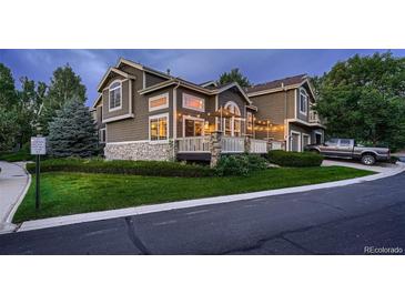 Charming townhome featuring stone accents and a welcoming front porch perfect for relaxing at 19551 E Mann Creek Dr # B, Parker, CO 80134