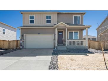Two-story house with attached garage and front porch at 6531 13Th St, Frederick, CO 80530